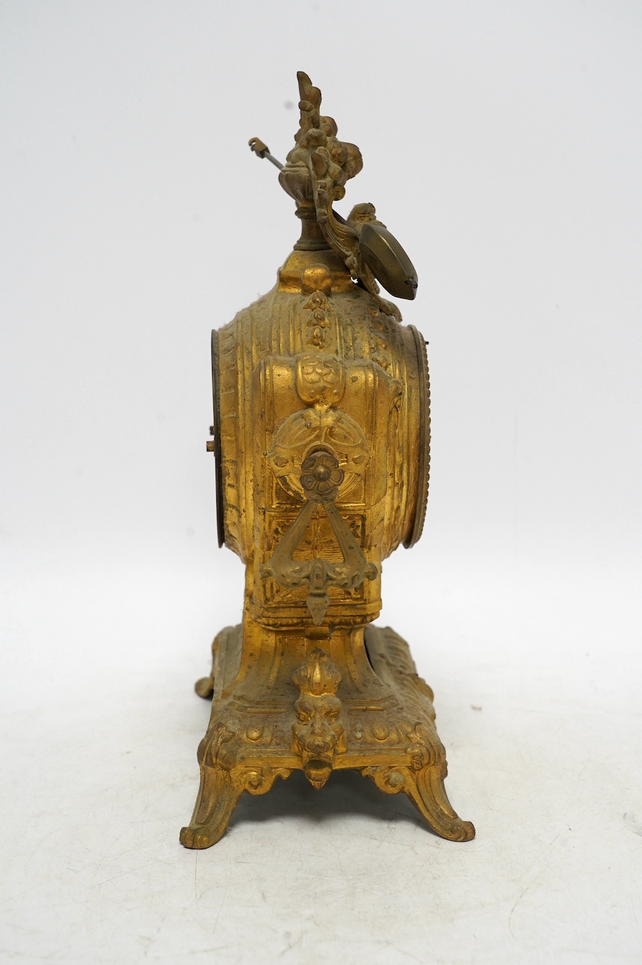 A 19th century gilt spelter mantel clock, with ceramic decorated dial and panel, 30cm high. Condition - not checked if in working condition, case fair